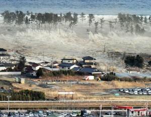 FINDING GOD IN DEVASTATION by Amelia Blanton A three-story tsunami obscures all but treetops as it roars into Natori, Japan, on Friday about the same height as the largest waves seen during the