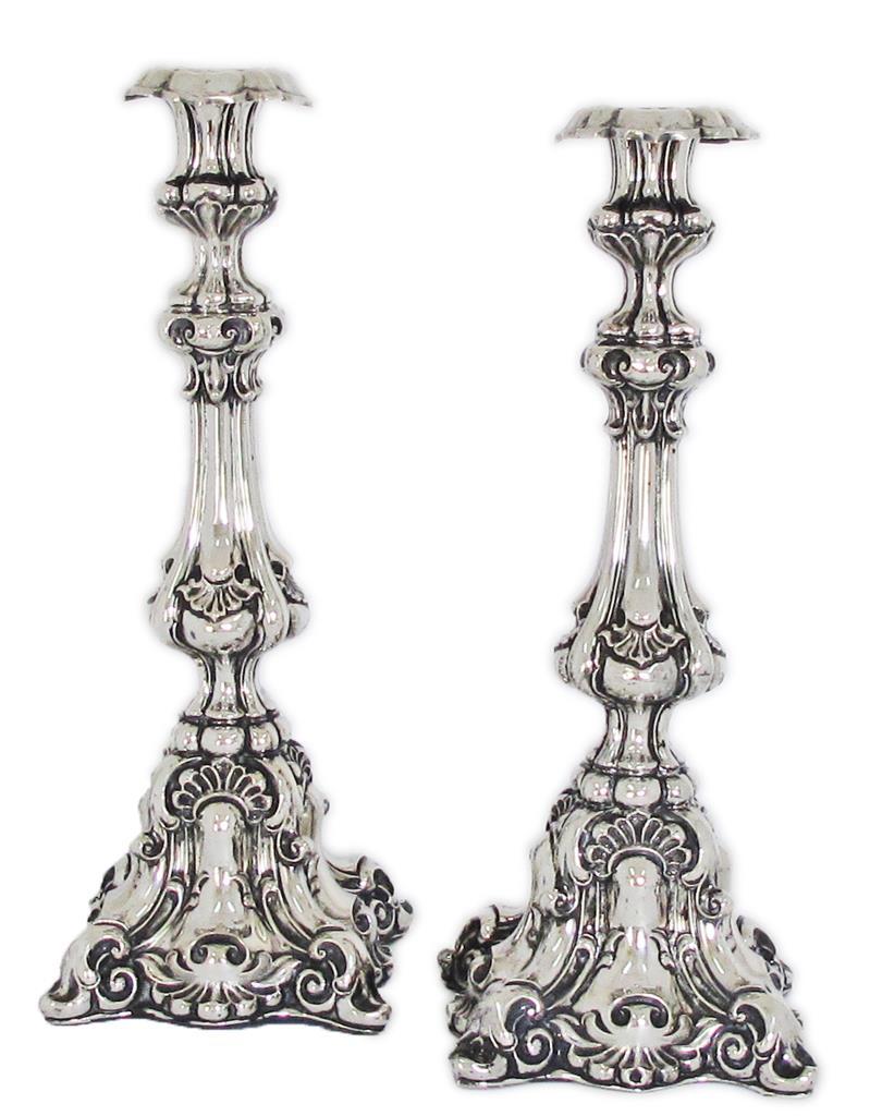 A pair of Louis XV German rococo silver candlesticks with engraved and repousse