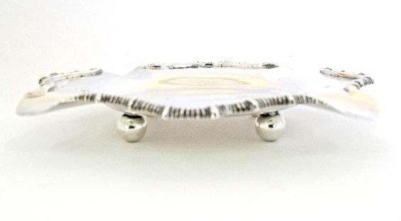 A sterling silver footed cake dish hallmarked