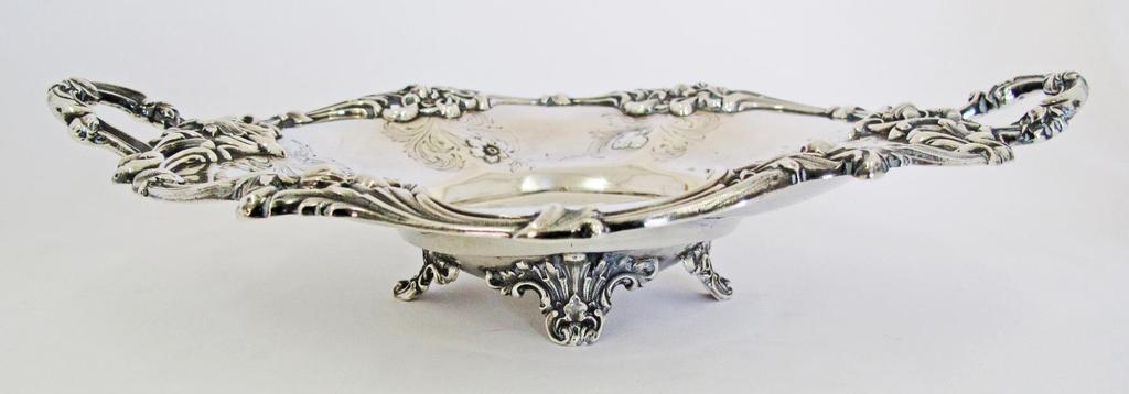 A sterling silver dish with handles by