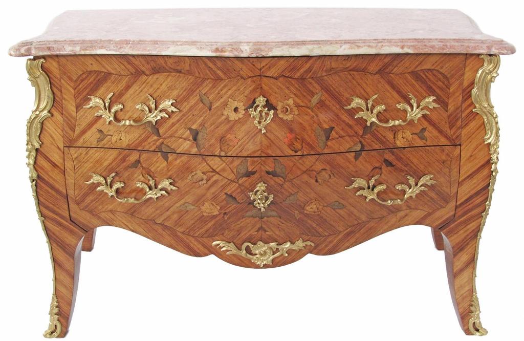 1900, Louis XV style, the 'salmon' pink variegated top above two marquetry inlaid long drawers,