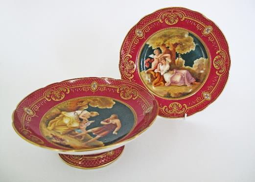 print porcelain dishes with Roman decorations within a dark blue border trimmed with gold, early 20th century.