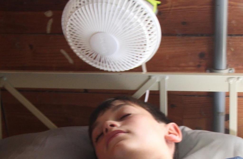simulated sleeping, with a clip on fan.