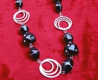 Original jewelry handmade of silver and glass designed and created by the artist Villy Bissylla.