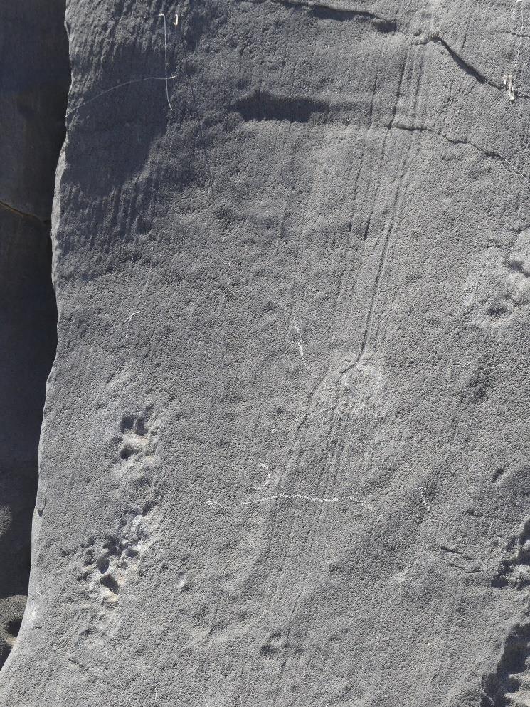 1 Rock carving of ships at a paved gateway to