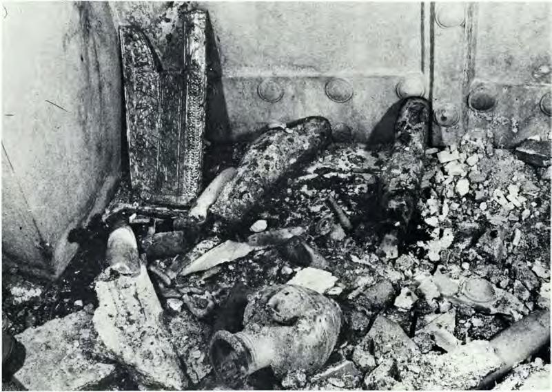 was found beside the sarcophagus underneath the fallen stucco ; I would suppose that it had hung on the wall and fallen to the floor or that it had been on a piece of wooden furniture which has
