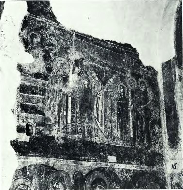 The Holy Towel is depicted on an embroidered white cloth; instead of in its usual place it appears in the central