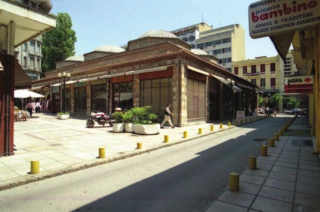 covered domes that correspond to the internal layout of the building. The stores located around the building were added in the early 20 th century.