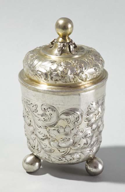 Alicja Kilijańska 032 The beaker is wrought of silver partly gilt; it has a cylindrical body spun in its lower part, supported on three spherical cast feet, and a plain band at the edge of the lip.