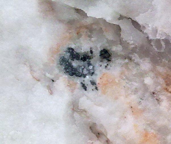 small rutile crystals; b.