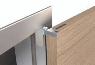The dividable aluminium frame allows easy installation in any type of wall. / Adjustable aluminium frame which embraces the wall. / Wooden panels with flat side can be integrated.