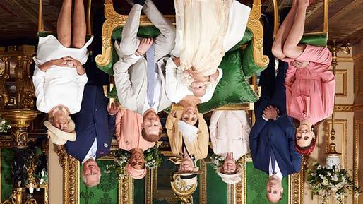 Sussex's baby son Archie's christening were released on Saturday; A black and white still of Prince Harry and Meghan holding Archie in the Rose Garden, and another of all those in attendance at the