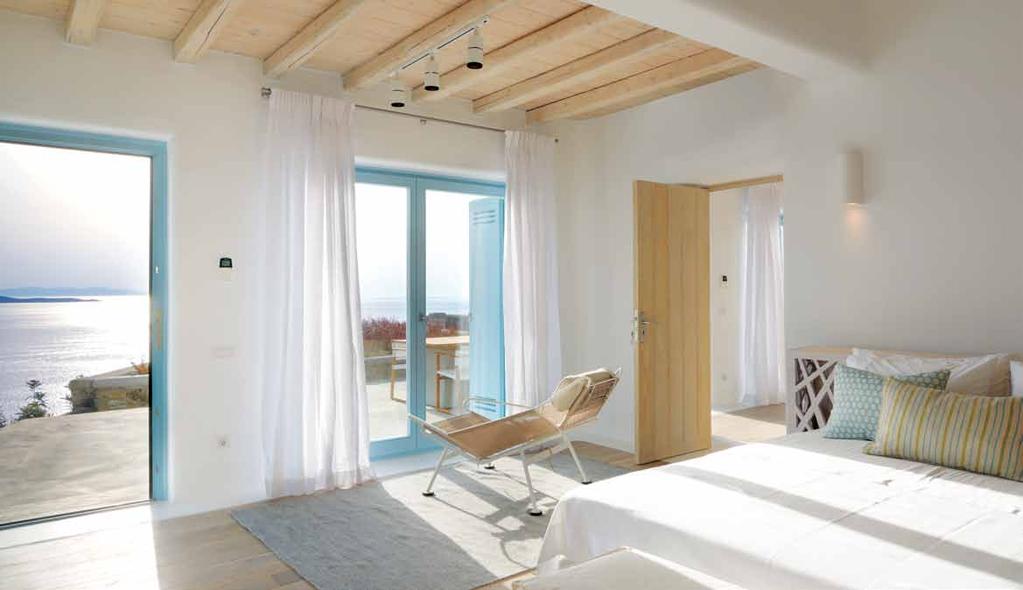 Εvery room has oak floors, while functional areas such as the kitchen and transition areas such as the staircase and corridors have white cement screed flooring.