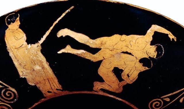 Σκηνή από πάλη Αριστερά ο παιδοτρίβης Ερυθρόμορφη αττική κύλικα, 430 π.χ.