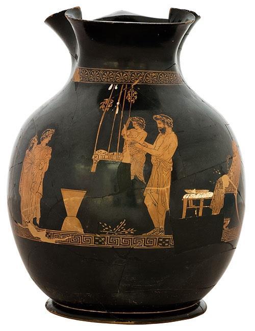 Άνδρας ετοιμάζεται να καθίσει παιδί σε αιώρα. Πιθανώς από το Κορωπί Αττικής.