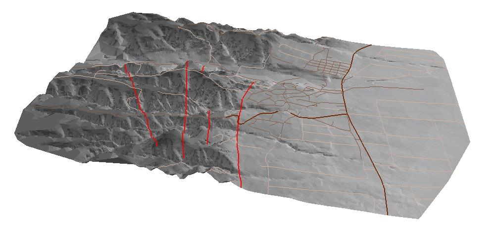 Εικόνα 2-6. Τρισδιάστατη υπερυψωμένη απεικόνιση της μορφολογίας στην περιοχή της Γερακαρούς. Διακρίνονται τα χαρτογραφημένα κανονικά ρήγματα (κόκκινες γραμμές) και το οδικό δίκτυο. Όψη προς τα ΝΝΑ.