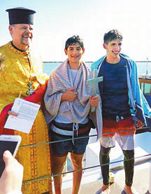 Y., with 3 Fr. John Sakellariou (assistant priest in red vestments) and the Rev. Dr. Christos B.