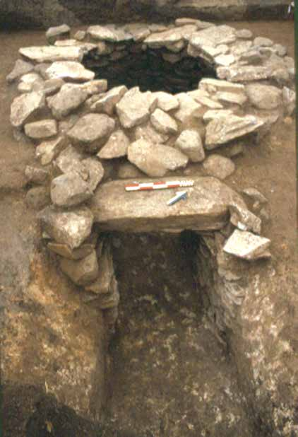 In most of them, pits cut in the floor were found, containing bones of earlier burials. The tombs were not looted. Their entrances were blocked with stones or large limestone slabs.