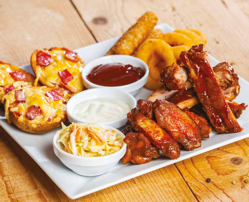 Combination of onion rings, loaded potato skins, oven baked BBQ chicken wings, cheesticks, BBQ pork ribs (half-rack) and coleslaw.