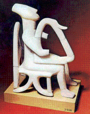 Ένα από τα αριστουργήματα της κυκλαδικής ειδωλοπλαστικής. Ο καθιστός άνδρας παίζει άρπα, συμμετέχοντας ίσως σε κάποια θρησκευτική τελετή (Αθήνα, Εθνικό Αρχαιολογικό Μουσείο).