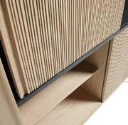 Bookshelf with sliding doors. Rounded edges of solid oak.