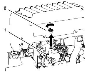 Συµπλήρωµα λαδιού στη µηχανή 1. Γείρετε το κάθισµα προς τα εµπρός, χαλαρώστε τις βίδες και αφαιρέστε το µπροστινό πλαίσιο της µηχανής. το λάδι να φτάσει την πάνω οπή του δείκτη λαδιού.