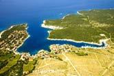 Veličina zemljišta: 10 ha Opis: Područje uvala Dražica-Šimuni je interesantno zbog turističkog razvoja mjesta i predviđenih planova gradnje