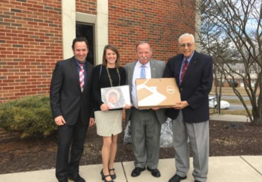 ( Right picture) Kosta Pappas finds the flouri (Left picture) The new Officers: Kosta Pappas, Maria Peslis, Gus Kokos, and Angeliki Lloyd.