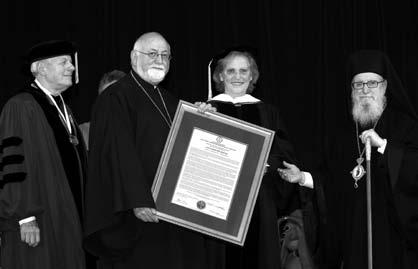 Degree to Rev. Dr. Alkiviadis C. Calivas. Also shown is Fr. Nicholas C.