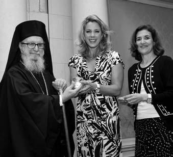 Leadership 100 members join His Eminence Archbishop Demetrios in a birthday celebration.