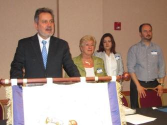 (Above): The General Assembly Chair, Dr. Paul Dallas, the Ambassador of Greece in the U.S.A., His Excellency Haris Lalacos, and Congresswoman Mrs.