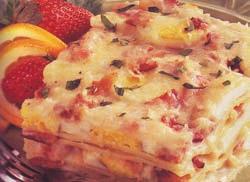 Layer with four noodles, a third of the eggs and bacon, Swiss cheese and white sauce. Repeat layers twice. Sprinkle with parmesan cheese.