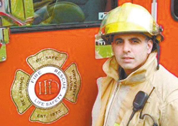 Mark Tan, ladder to a second floor window, where a Toronto Police Service; Const. Patrick woman was trapped by the flames in her Benoit, Kingston Police; Const. Jason apartment.