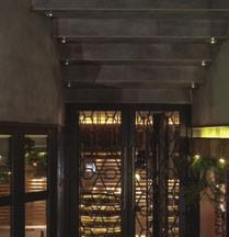 arches combined with glasses and wood, making the building a landmark in the broader area.
