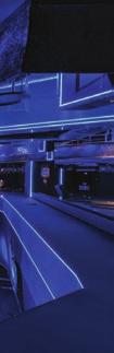 Strips of mirrors and linear lightings run across the three dimensions of the tunnel leading to the club s central space,