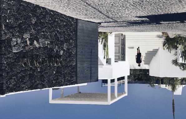 Dark crude stone frames the back of the space evolving into a cavernous restaurant area.