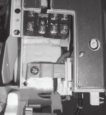 Open the panel of indoor unit as show in the fig and unscrew the screw on the electric box cover.