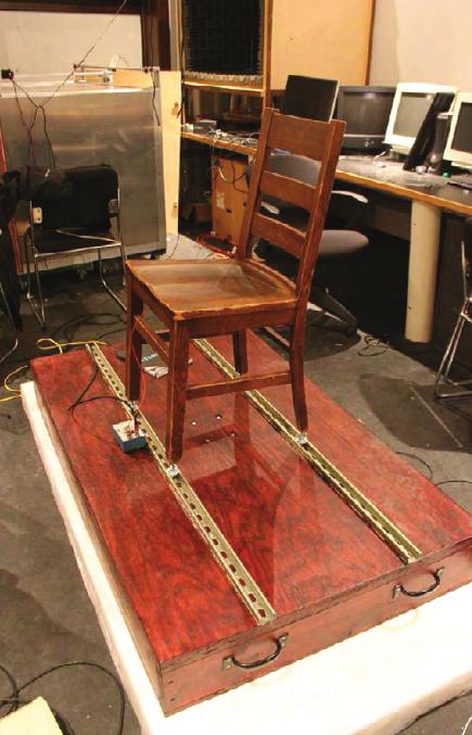 One of the problems with audio tactile displays is that the vibration platform on which the listener sits can also radiate sound energy when it is moving, and the actuating mechanism can make some
