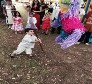 participating in an Easter Egg Hunt, a bouncy castle, and Easter Piñatas The