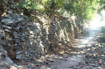 Standard retaining walls, in the photograph, showing the fixation of the slope to the top of it Kallithea Thermo