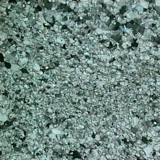 Υπέρ-λεπτόκοκκη δολομιτική κρυσταλλική μάζα των λευκών λατυπών με επικρατέστερες διαστάσεις κόκκων από 0,08 mm έως 0,10 mm. Nicols, μεγέθυνση Χ50. γ.
