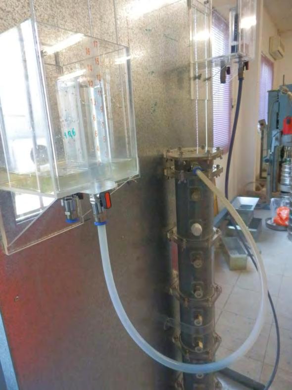Chapter 5: Injection tests of colloidal silica into granular soil Figure 5.25 Full coverage (breakthrough) of 1m sand column with injected dyed blue CS solution in Test No8.
