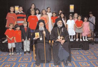 OUR ARCHDIOCESE Clergy children with Archbishop Demetrios and Metropolitan Panteleimon at