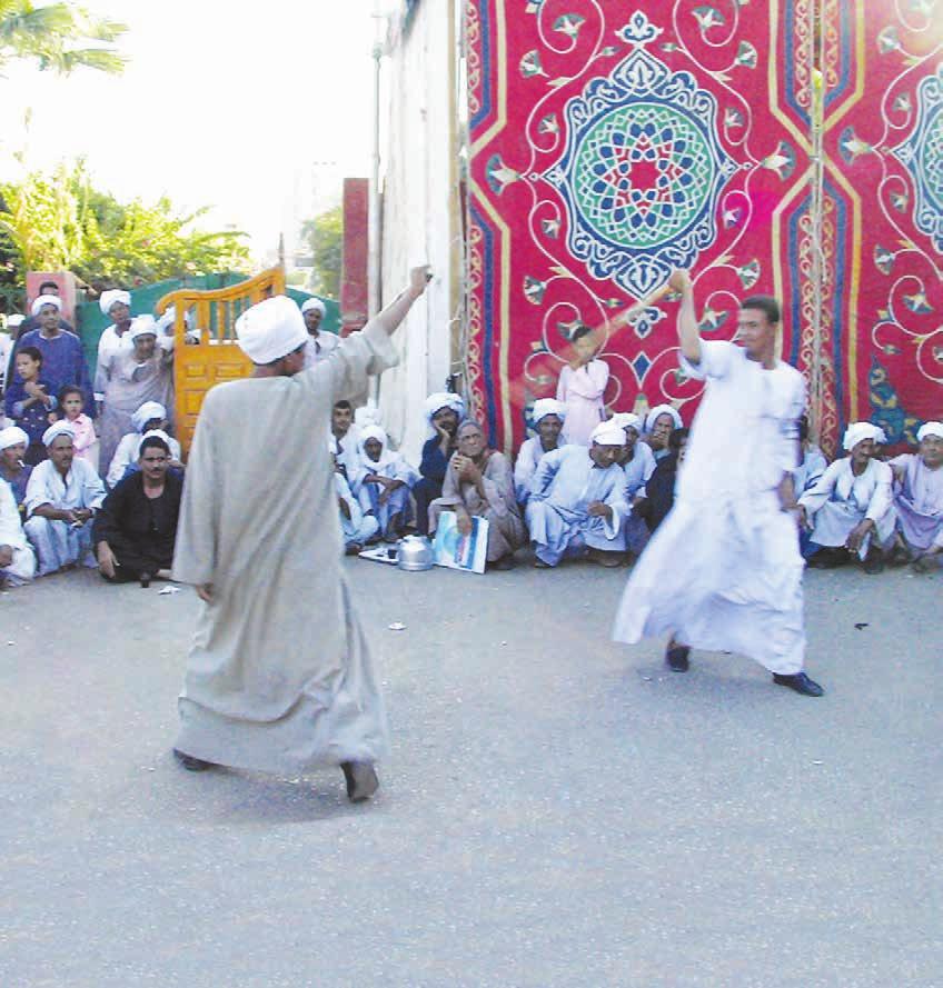 16 Folk Culture Spring 2010 AL TAHTIB Wrestling with Sticks Husam Mehasseb (Egypt) Wrestling with Sticks AL TAHTIB is one of many popular games played in Upper Egypt which are