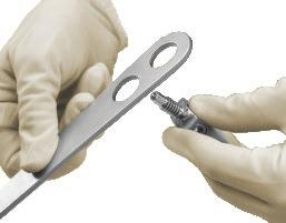 ( This step may be done before or after attaching retractor handles to the frame.