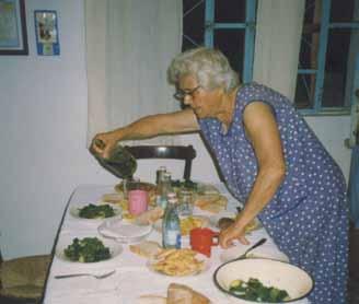 ΚΡΗΤΙΚΗ ΚΟΥΖΙΝΑ Cretan Cuisine Vegetarian Delights GEORGE VUTETAKIS Chef George Vutetakis Great Aunt Yeorgia Stratigakis dressing her horta with olive oil from her trees.