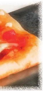 As I lift it, the cheese stretches and gradually separates from the box. I put it on a plate and I admire its variety of different colors.