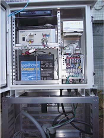 -,.** Fig. 2. External view of the above-ground part of an observatory. From top left to bottom left: ISDN router, power source controller, and accumulator.