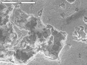 12: SEM images of the eroded mild steel test specimen (a) At 4% slurry concentration, 4 ms -1 impact