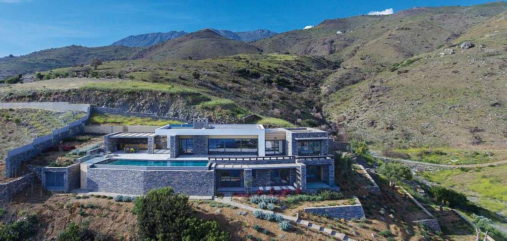 The design aimed for the smooth integration of the building in the sloping plot, with full exploitation of the views and protection from the westerly winds, always taking into account operational
